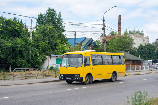 CHERNIVTSI, UKRAINE - June 14, 2023. Bus Bogdan A091 riding with passengers in the streets of Chernivtsi.
