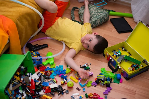 Cute Six Year Old Child Boy Lies Floor Pile His — Stock Photo, Image