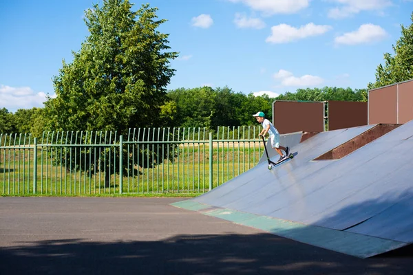 Seven Year Old Child Boy Slides High Hill Scooter Skatepark — Stock Photo, Image