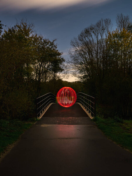 Light painting on a bridge - red ball light painting — Stock Image Light Painting Bridge Red Ball Light Painting Stock Photo