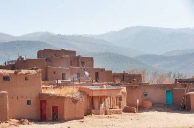 Typical housing in ancient Taos Pueblo Native American reservation, UNESCO world heritage site, New Mexico, USA clipart