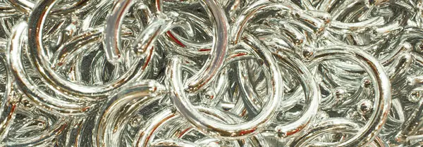 stock image abstract background made of silver rings for crafting supply
