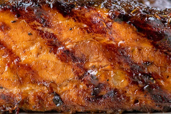 Texture of fried fillet glazed pork, close-up. Grilled Pork Rib.