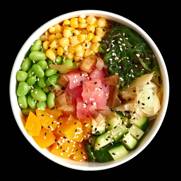 Stock image Top view of Tuna poke bowl isolated on black background. Ready square menu banner with text and copy space.