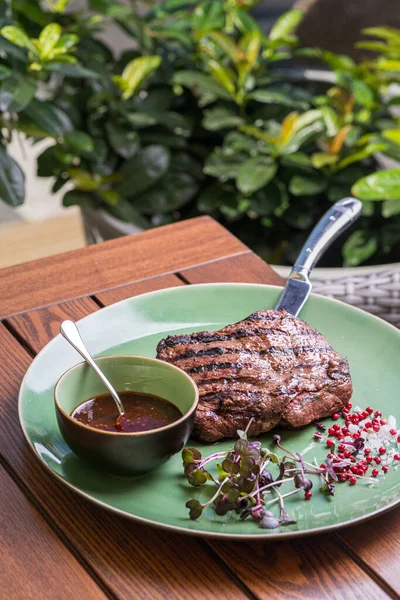 grilled beef steak with spices on a knife. Healthy food, diet lunch concept. diet menu. Food on plate. Restaurant menu concept. Copy space.