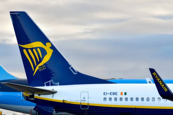 stock image St Athan, Wales - November 2022: Tail fin and winglet of a Ryanair Boeing 737 parked outside the hangar of the Caerdav aviation maintenance company at the St Athan airport in south Wales