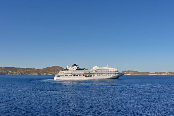 Patmos, Greece - May 2022: Luxury cruise ship Seabourn Encore turning in the bay off the coast of the Greek island of Patmos