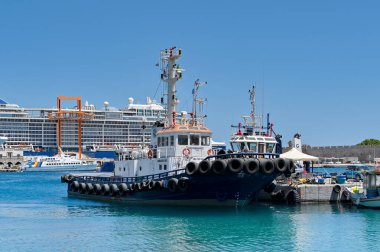 Rhodes, Greece - May 2022: Tug boat moored in the town's commercial port