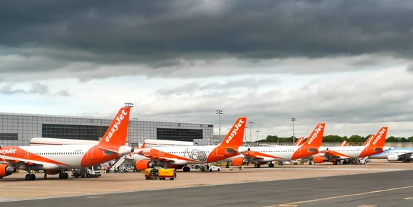 stock image London, England - May 2022: Row of Easyjet Airbus planes at the airline's Gatwick airport base.