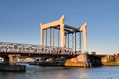 Dordrecht, Netherlands - August 2022: Vertical lifting bridge which lifts railway tracks to allow ships to pass on the River Maas.