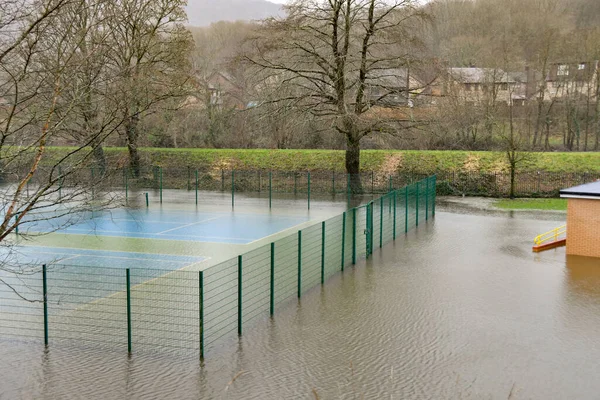 stock image Taffs Well, Cardiff, Wales - January 2023: Village tennis court underwater after flooding from the River Taff