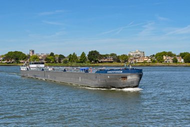 Dordrecht, Netherlands - August 2022: Oil tanker barge Griffioen sailing on the River Maas.