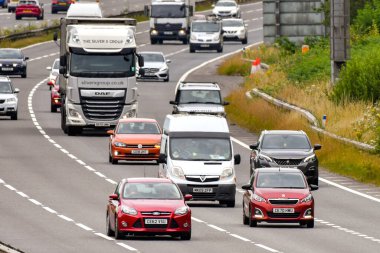 Miskin, near Cardiff, Wales - July 2022: Articulated lorry and other traffic on the M4 motorway