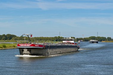 Rotterdam, Nertherlands - August 2022:  Oil tanker ship Nauta sailing on the Nieuwe Maas river.