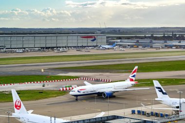 London, England - April 2022: Boeing 777 operated by British Airways taxiing for take-off