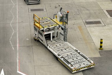 London, England - April 2022: Specialist airport vehicle for loading air freight pallets into aircraft