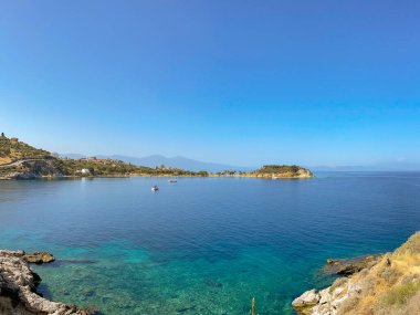 Kusadasi, Turkey - May 2022: Scenic landscape view of the bay of water in front of the town of Kusadasi