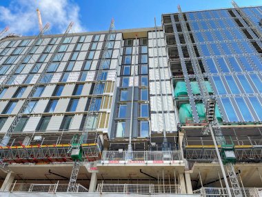 London, Uk - August 2022: Cladding being installed on the outside of a new office building in central London