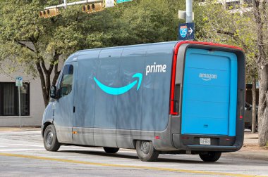 Austin, Texas - February 2023: Electric delivery van operated by Amazon Prime on a street in the city centre