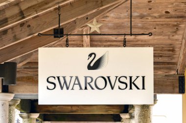 San Marcos, Texas - February 2023: Sign outside a factory outlet store for Swarovski