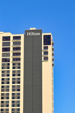 Austin, Texas, USA - February 2023: Sign on the outside of the Hilton hotel in the city centre