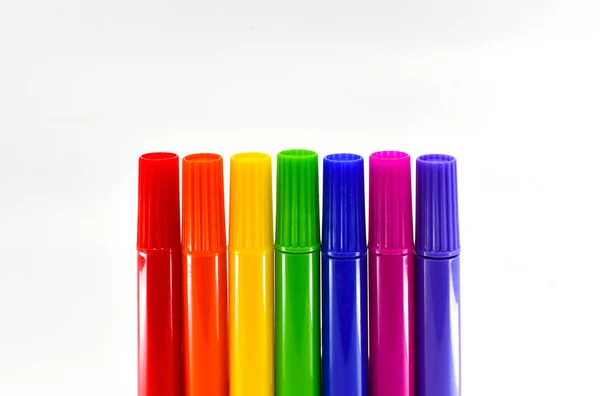 stock image Row of coloured market pens isolated against a plain white background. Copy space. No people.