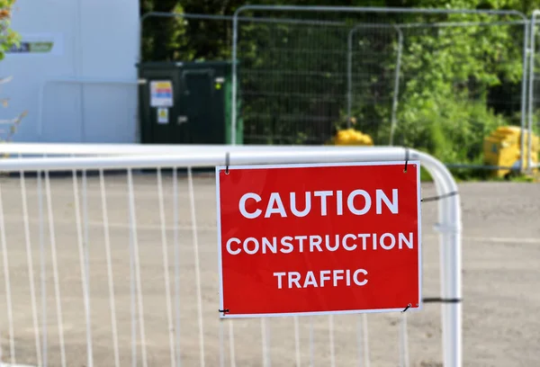 Warning Sign Advising Pedestrians Construction Traffic People — Stock Photo, Image