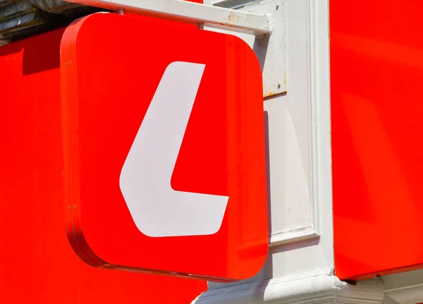 stock image Cardiff, Wales - 8 June 2023: Sign above the entrance to a branch of Ladbrokes betteing shops