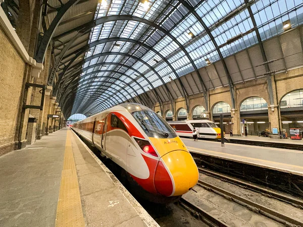 stock image London, England, UK - 27 June 2023: High speed train alongside one of the platforms at London King's cross railway station. The train is operated by LNER.