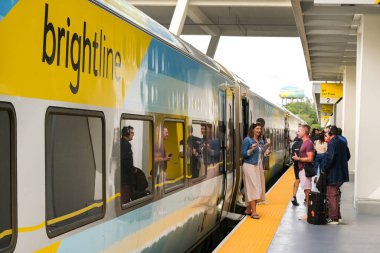 Fort Lauderdale, Florida, USA - 2 December 2023: Express train operated by Brightline between Miami and Orlando stopped at Fort Lauderdale railway station. clipart