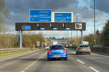 Newport, Wales, UK - 10 January 2024: Traffic driving on the M4 near Newport in south Wales clipart