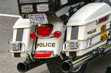 Washington DC, USA - 1 May 2024: Close up view of the rear of a police motorbike parked on a street in Washington DC clipart