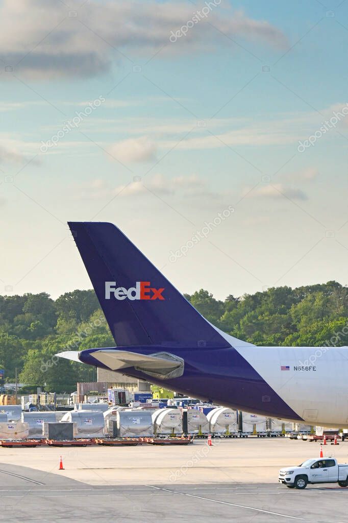 Baltimore, Maryland, USA - 3 May 2024: Tail fin of  Boeing 767 cargo jet (registration N656FE) operated by Federal Express FedEx at Baltimore Washington International airport.