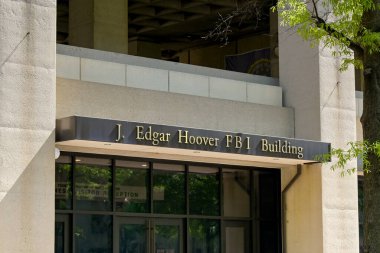 Washington DC, USA - 2 May 2024: Entrance to the headquarters of the FBI in the J Edgar Hoover building in downtown Washington DC clipart