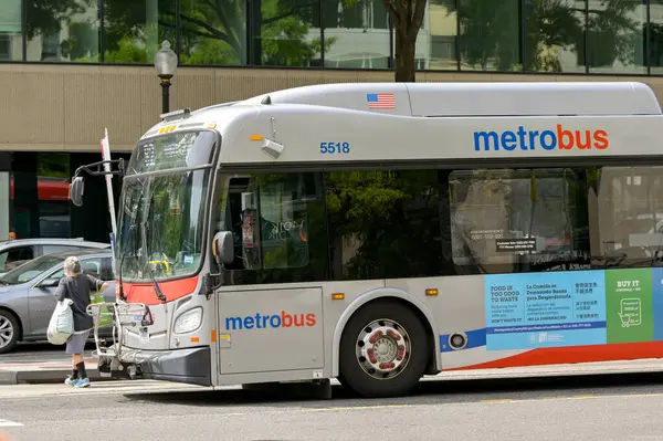 stock image Washington DC, USA - 3 May 2024: Metrobus  public service bus on a street in downtown Washington DC