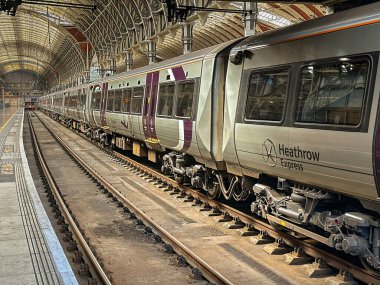 London, England, UK - 3 July 2024: Heathrow express airport shuttle service train at London Paddington railway station clipart