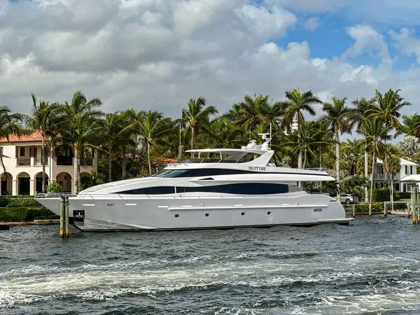 stock image Fort Lauderdale, Florida, USA - 2 December 2023: Luxury motor yacht Idletyme moored alongside a home on one of the canal waterways of Fort Lauderdale