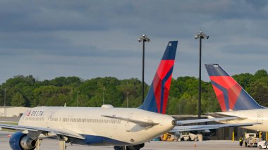 Baltimore, Maryland, USA - 3 May 2024: Tail fins of aircraft operated by Delta Air Lines at Baltimore Thurgood Marshall Airport clipart