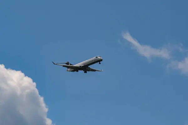 stock image Alexandria, Virginia, USA - 1 May 2024: Bombardier CRJ 900 jet (registration C-GJZT) operated by Air Canada Express approaching Ronald Reagan National Airport in Washington DC