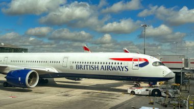 London, England, UK - 4 May 2024: Airbus A350 (registration G-XWBL) operated by British Aiirways at Terminal 5 in London Heathrow airport. clipart