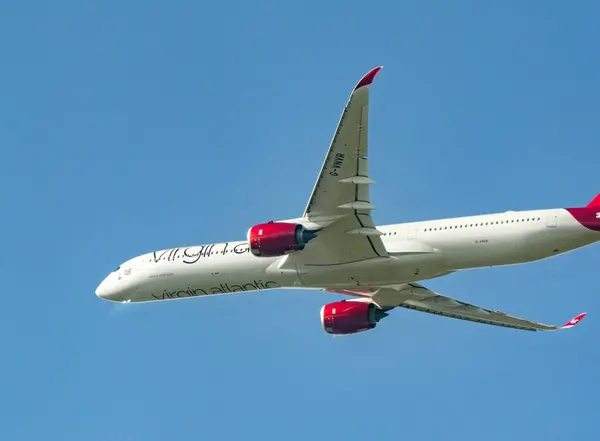 stock image London, England, UK - 28 April 2024: Airbus A350 (registration G-VNVR) operated by Virgin Atlantic Airways climbing after take off from London Heathrow airport.