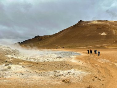 Hverir, Iceland - 24 August 2024: Tourists at the hot springs around the geothermal area of Hverir clipart