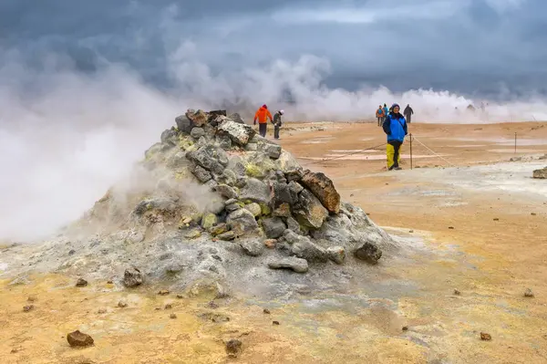 stock image Hverir, Iceland - 24 August 2024: Steaming fumaroles at the hot springs around the geothermal area of Hverir