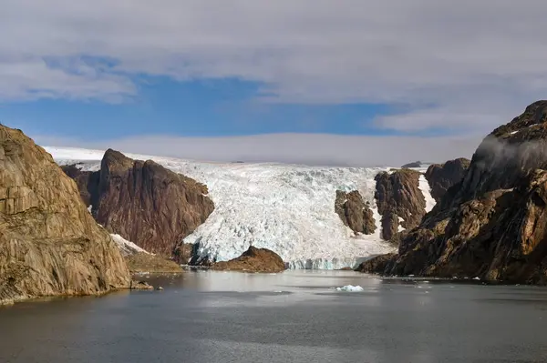 stock image Scenic landscape view of a glacier at the water's edge of a fjord in Prince Christian Sound in Greenland