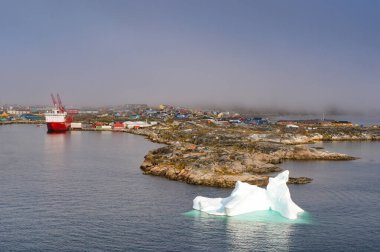 Nanortalik, Greenland - 27 August 2024: Large iceberg near the town's harbour clipart