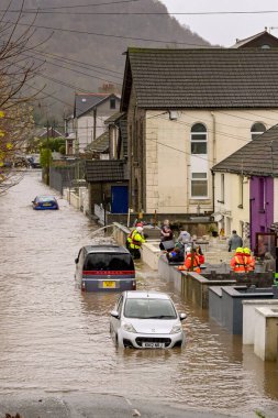 Pontypridd, Wales, UK - 24 November 2024: Flooding in a street near the town centre after the River Taff burst its banks following heavy rain from Storm Bert clipart