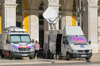 Lisbon, Portual, Europe - 13 January 2025: Television transmitter vans of the RTP TV channel parked outside the Portuguese Supreme Courts of Justice in Lisbon for a news broadcast. clipart