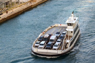 Miami, Florida, USA - 4 January 2025: Aerial view of one of the car ferries which transport vehicles to and from the exclusive Fisher island in the harbour of Miami clipart