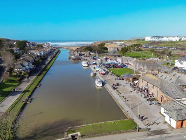 Bude, Cornwall, England, UK - 22 February 2025: Aerial view of the Bude Canal with boats and yachts moored on the quay. clipart