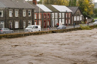 Treforest, Wales, UK - 24 November 2024: River Taff in flood after heavy rain from Storm Bert clipart